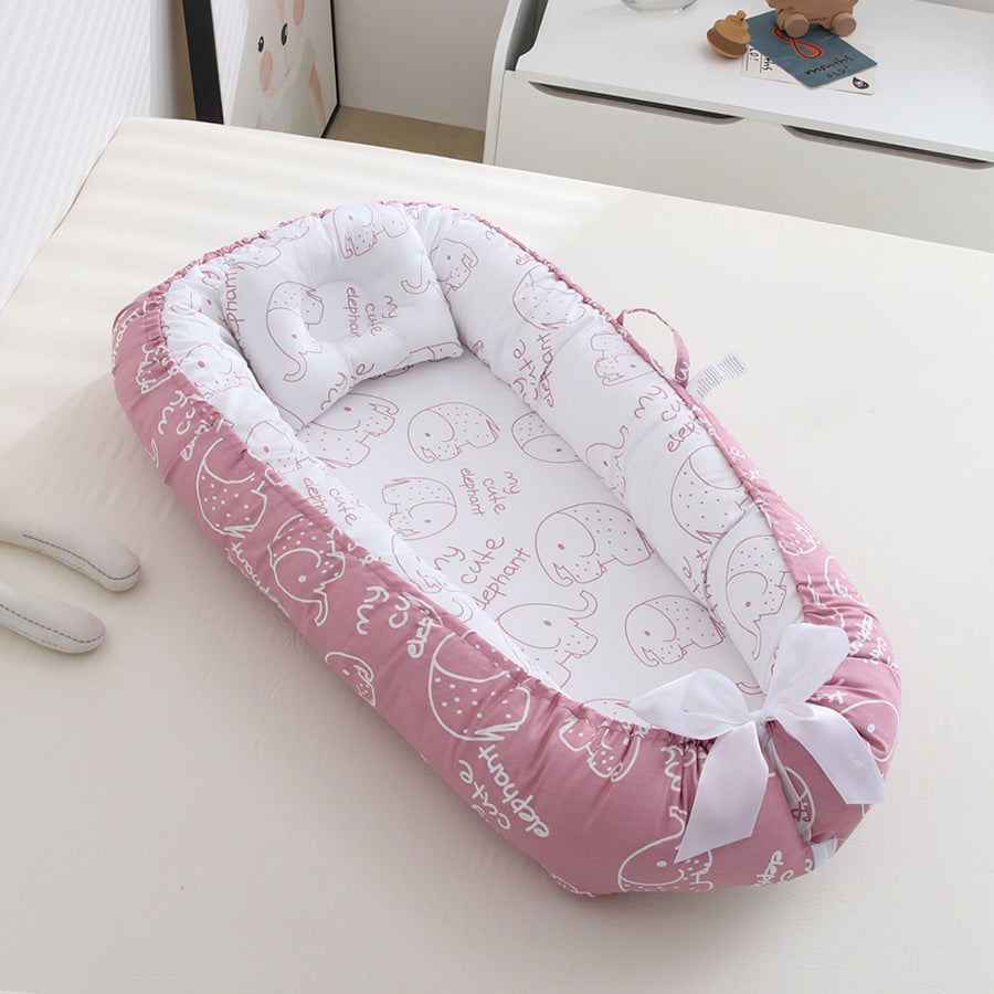 Nid-d_ange-Cocon-du-lagon-blanc-rose-bonbon_caab891d-e2d7-4556-9ca1-81d13aed560a